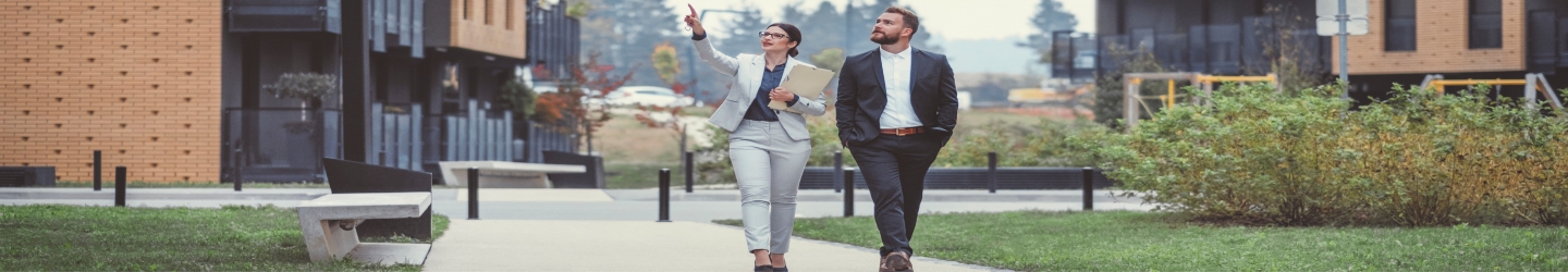 man and woman walking along path